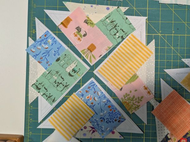 An in-progress Woven Star quilt block being made by That Crafty Cara (Cara Brooke) for her Star Climber scrap quilt.