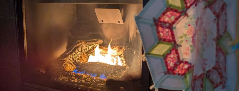 Smitten English-paper-pieced quilt illuminated by the glow of a fire during a power outage during a windstorm in Washington State