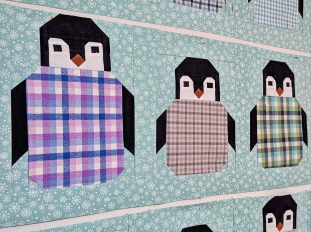 Penguin Party quilt made with pastel plaid flannels