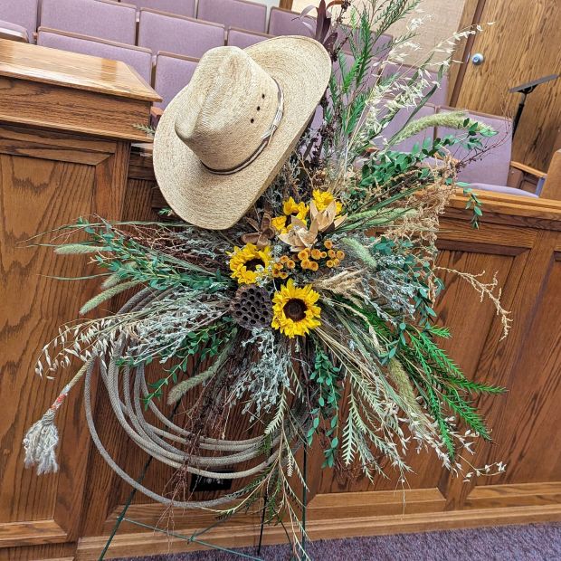 Western Cowboy Funeral Flower spray with cowboy hat and rope/lariat at a Montana funeral