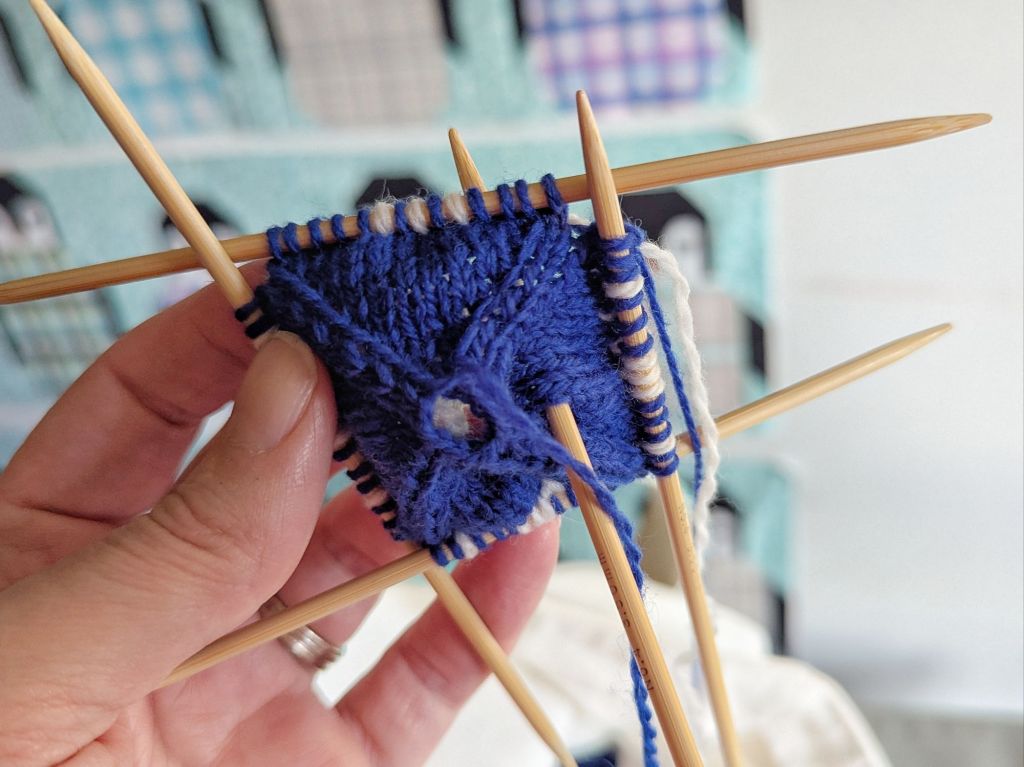 Arne & Carlos knit Christmas Ball in-progress, made with blue and white yarn.