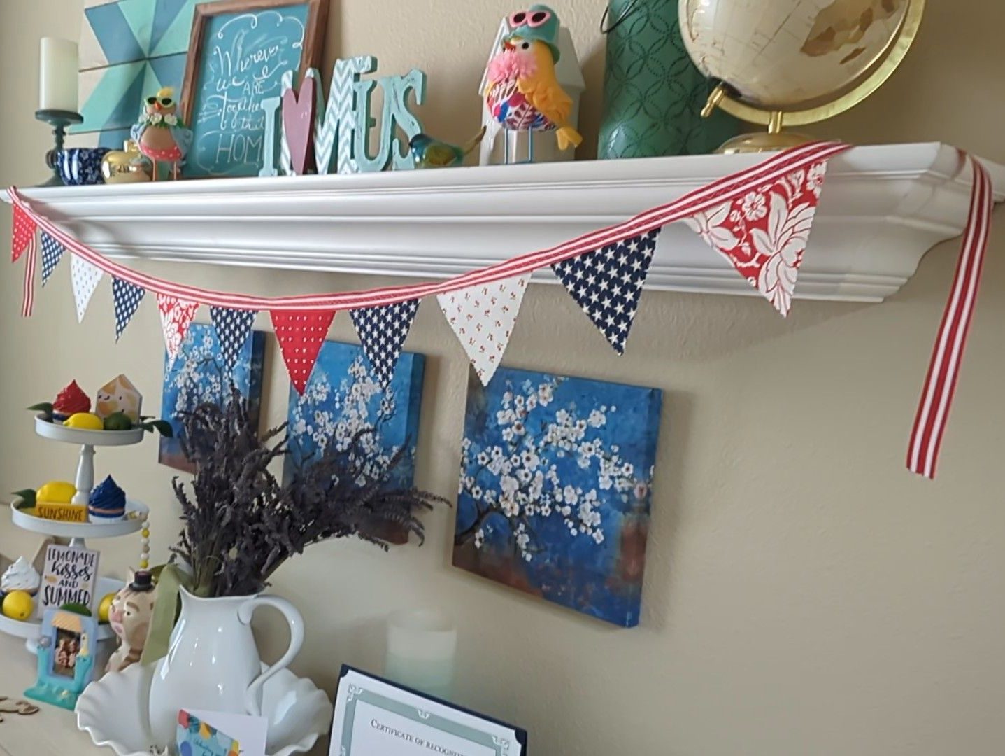Fourth of July patriotic American fabric bunting made with red, white, and blue fabric scraps and red and white striped ribbon