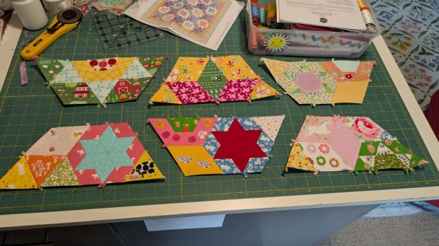 "Smitten" English paper-pieced half hexagon quilt blocks, made with bright quilting fabric scraps