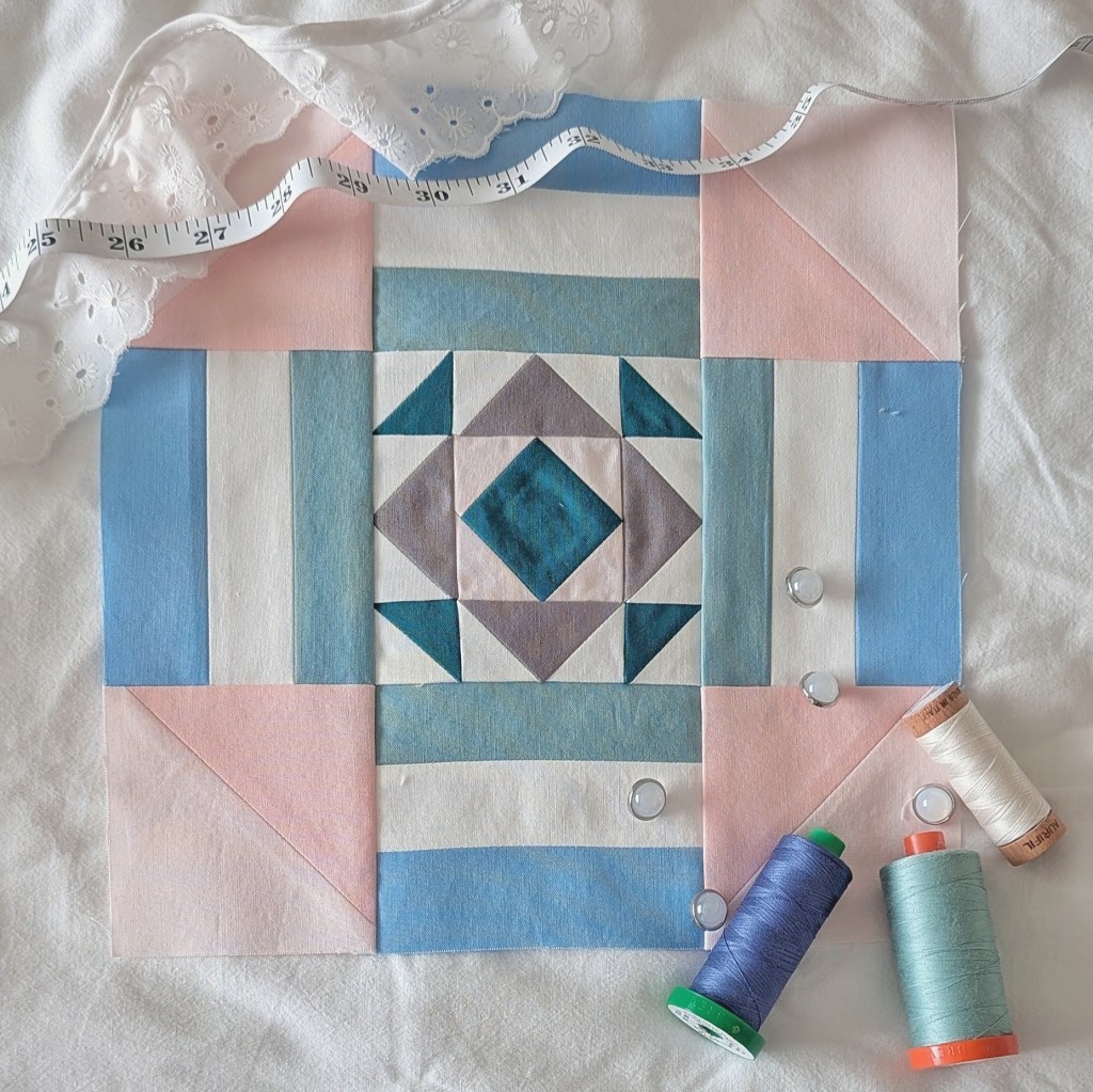 Block 1 in the RBD 2026 Block Challenge Sew Along sewn in pinks, blues, and green