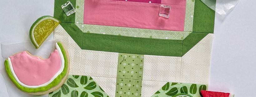 Sewcialites 3 Block #7 Flower made with green and pink fabrics and altered to look like a watermelon flower.