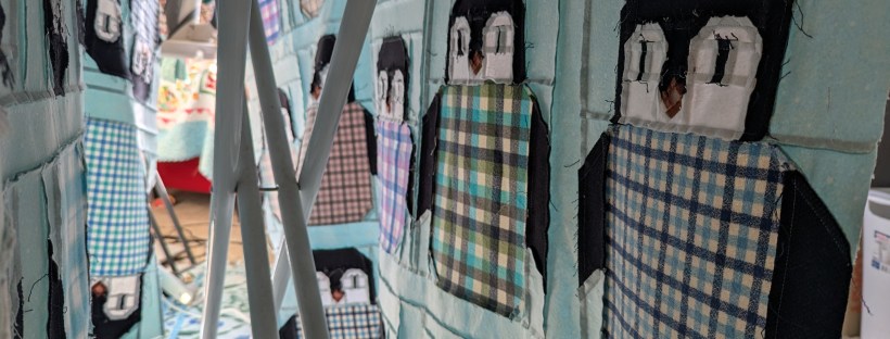 Penguin Party quilt top in-progress, made from aqua and pastel flannel fabrics