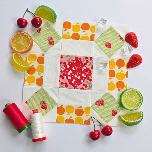 Block 13 "Back Porch," in the Fat Quarter Shop Sewcialites 3 sew along, designed by Joanna Figueroa. Sewn up in red, pink, orange, yellow and green.
