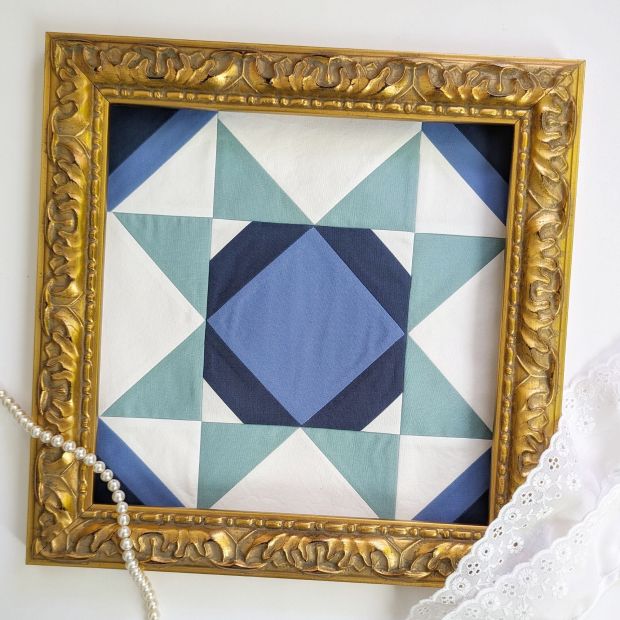 Block 16 "Kaleidoscope Star," designed by Tara Reed for the Riley Blake Designs Block Challenge 2026 sew along in shades of green and blue.