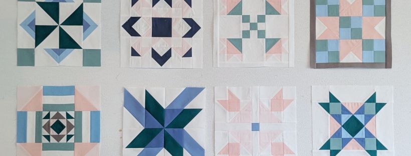 All the blocks in the Riley Blake Designs Block Challenge 2026 sew along, sewn by Cara Brooke of That Crafty Cara in blue, pink and green.