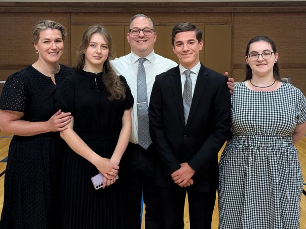 Family dressed in black at an LDS funeral.