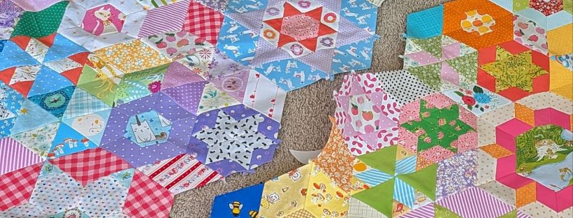 A Smitten English paper-pieced quilt in-progress.