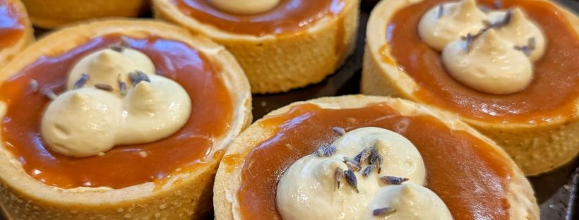 London Fog Custard Tarts with caramel, earl grey whipped cream and a sprinkle of lavender buds on top.
