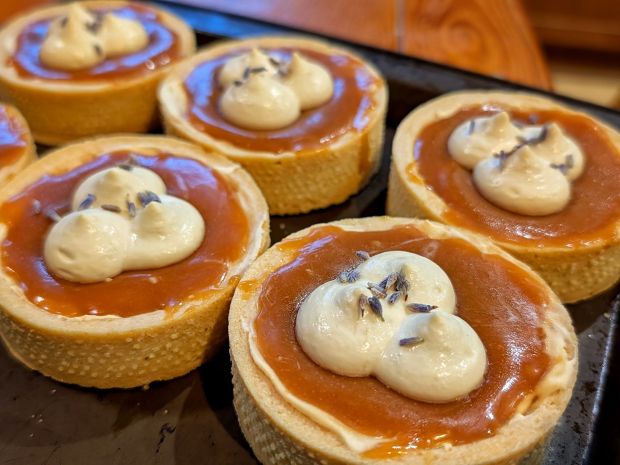 London Fog Custard Tarts with caramel, earl grey whipped cream and a sprinkle of lavender buds on top.